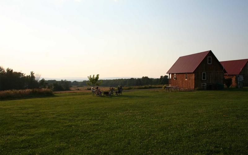 Relaxing by the cabins during sunset